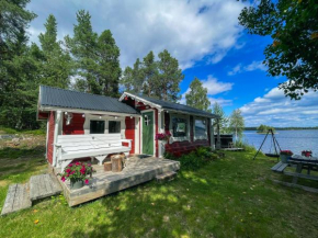 Laplandliv cabin on the lake with hottub, Björkliden